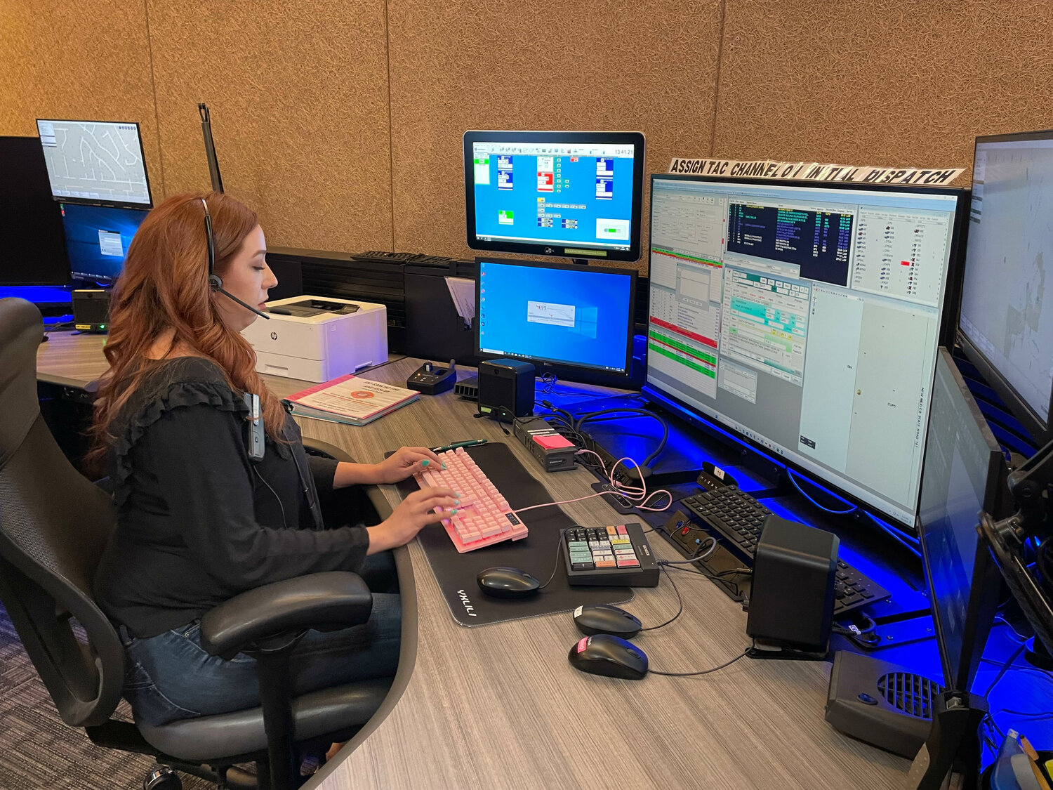 Dispatcher Ryley Thompson works one of the stations at the Sandoval County REgional Emergency Communications Center. (T.S. Last/Sandoval Signpost)