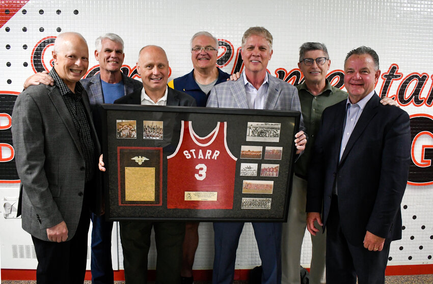 Pictured left to right are: Lou Reiner, Dave Scharer, Terry Ferguson, Rod Achter, Jeff McNally, Mark Dansack and Mark Stahl, who are pictured with their donated framed jersey and photos.