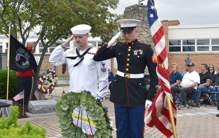 Clay High School graduates, Jacob Keith (U.S. Navy) and Chase Lambrecht (U.S. Marine Corps) are pictured placing a wreath at Clay High School's Memorial Day ceremony in 2024.