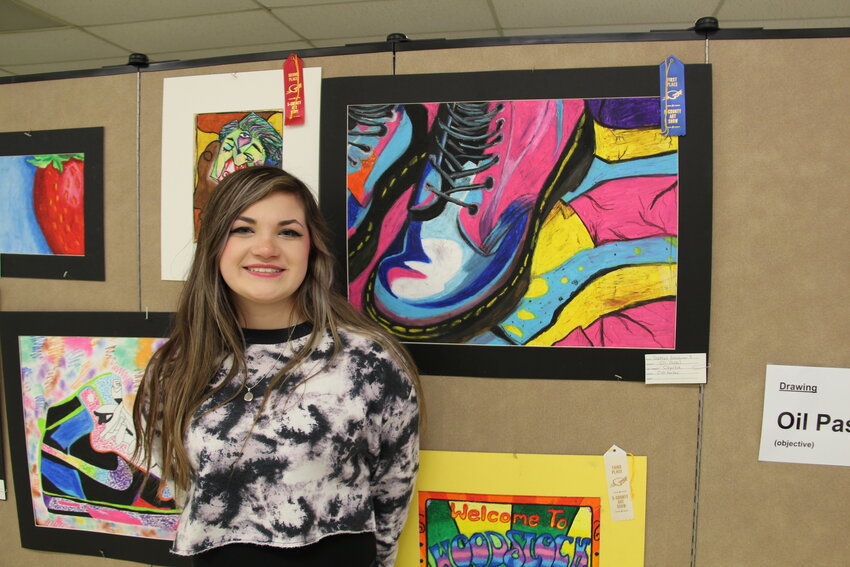 Brooklyn Garcia, a sophomore at Oak Harbor High School, is shown with her work at the 2024 Five-County Art Show.