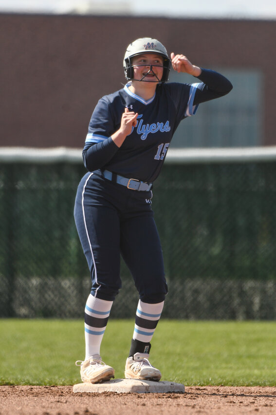 Lake's Norah Demory celebrates with her teammates in the dugout while standing at second base during a recent game against Northwood.