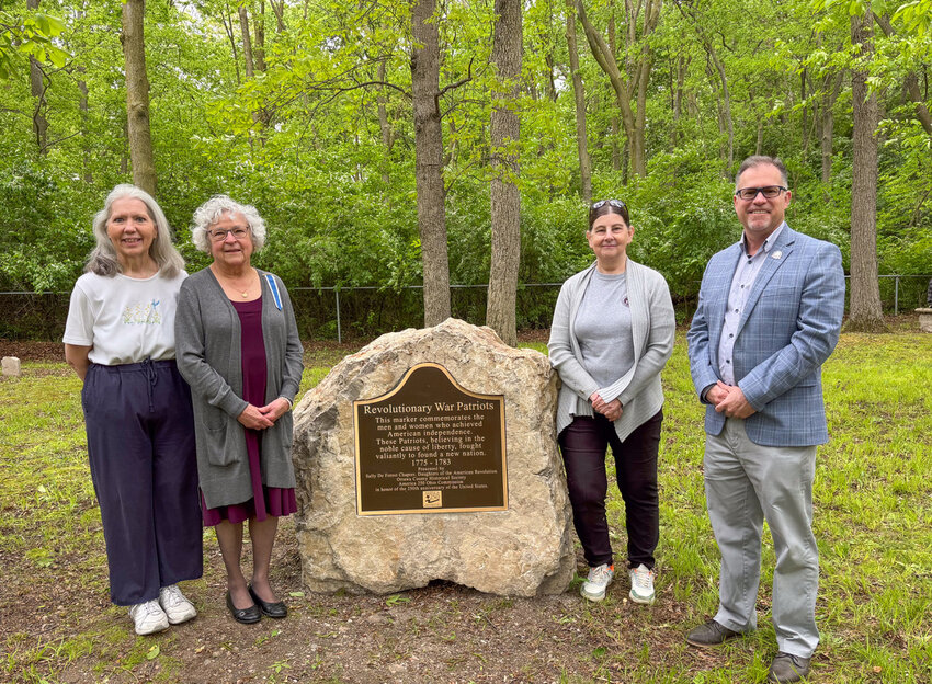 From left to right: Ottawa County-America 250 Committee Chair, Linda Huber; Jerilynn Scheele of the Norwalk Chapter of Sally De Forest DAR; Lisa Hossler of the Ottawa County Historical Society; and America-250 Ohio Commission Executive Director Todd Kleismit stand near the new DAR Patriot Marker at the gravesite of Benajah Wolcott.