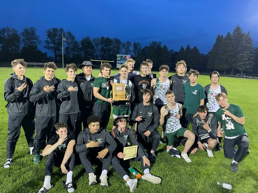 Oak Harbor's boys track and field celebrates their league championship.
