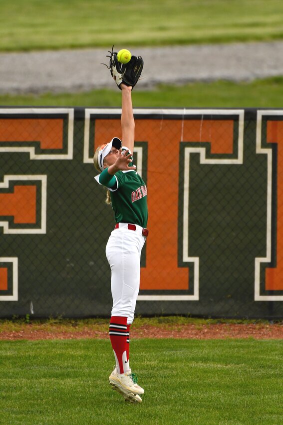 Oak Harbor centerfielder Tatum Baumgartner rises to make a catch in a win over Otsego on May 17, 2025.