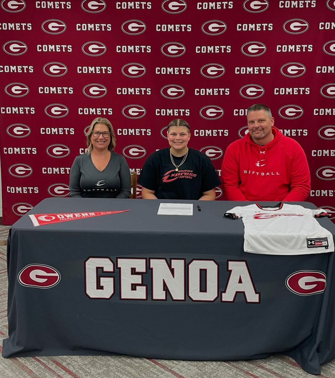 Madelyn Bronowski is pictured with her parents after signing with the Owens softball program.