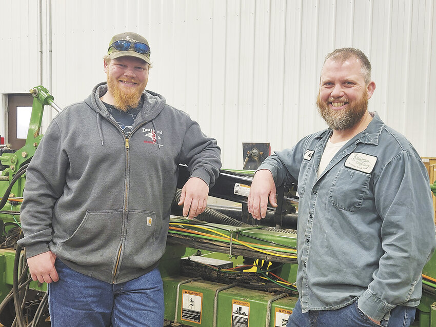 Ryan (left) and Nate White take a break from shop work April 2 at their farm near Reedsburg, Wisconsin. The brothers operate their family’s 860-cow dairy with their parents, Jerry and Linda, in Sauk County.