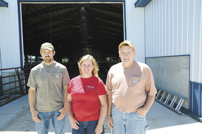 The Payne family — Brent (from left), Tammy and Daryl — take a break June 26 on their farm near Sullivan, Wisconsin. The Paynes, who milk around 200 cows, began milking their herd with robotic milking units in November 2023.