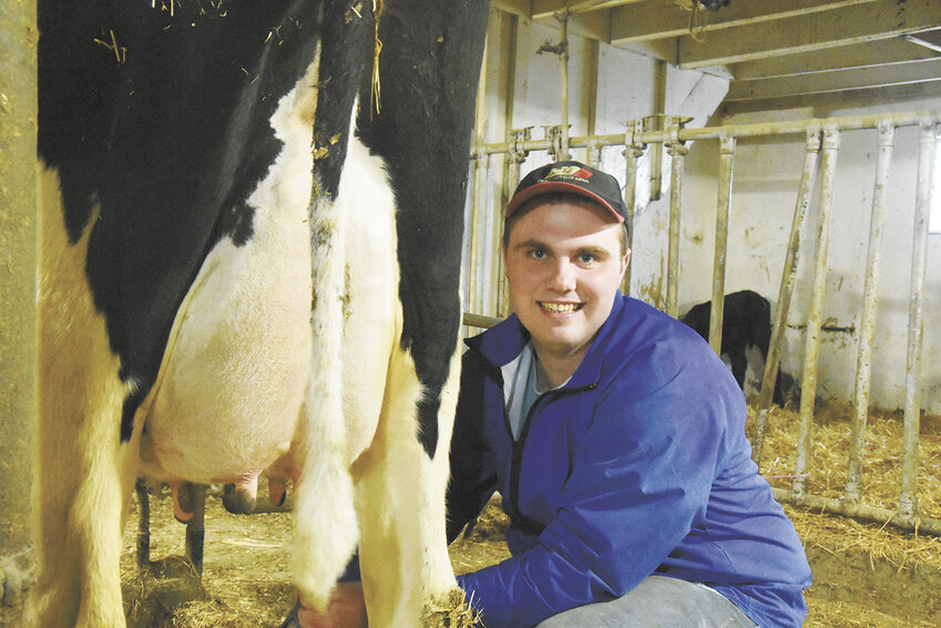 Tyler Roerick milks a cow March 3 at his family’s farm near Freeport, Minnesota. Roerick became part owner of his family’s farm Feb. 1, 2024.