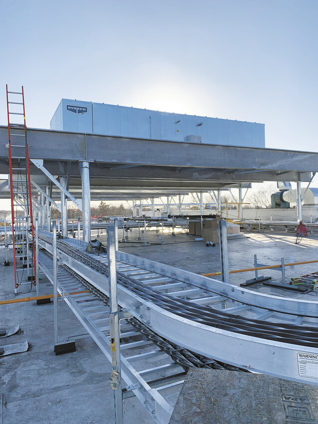 Air handling units for the processed cheese portion of the Associated Milk Producers Inc. plant glisten on the roof mezzanine as part of the rebuild process Feb. 7 in Portage, Wisconsin. AMPI is in the final steps of restoring production at the Portage cheese processing and packaging plant following a fire in 2023.