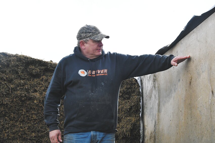 Matt Hendel shows what the new fill line will be on bunkers April 18 at his 430-cow dairy near Caledonia, Minnesota. Hendel will leave about a foot of space at the top of the bunker so that workers cannot slip off the top.