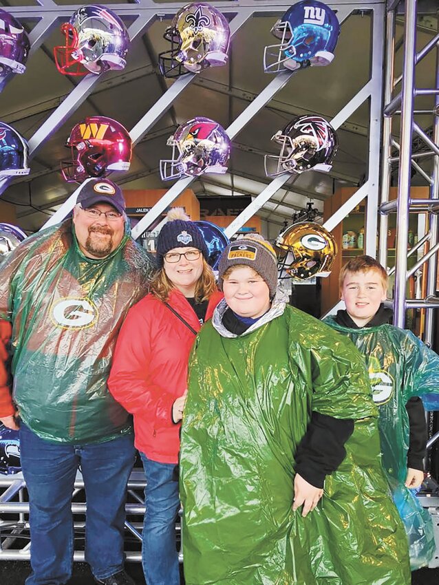The Riewe family — Charlie (from left), Keriann, Greyson and Bennett — attends the NFL Draft April 25 in Green Bay, Wisconsin. They said their experience at the NFL Draft felt like attending a huge game-day tailgate party.