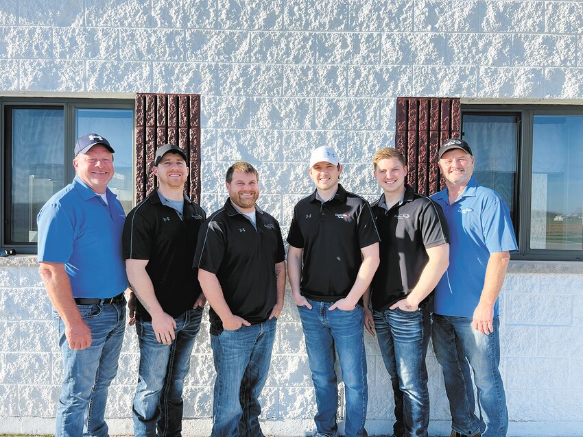 The Gerrits family — Tom, Craig, Nick, Matt, Jon and Mike — gathers May 6 at Country Aire Farms near Greenleaf, Wisconsin. The family milks 6,000 cows and farms 7,640 acres.