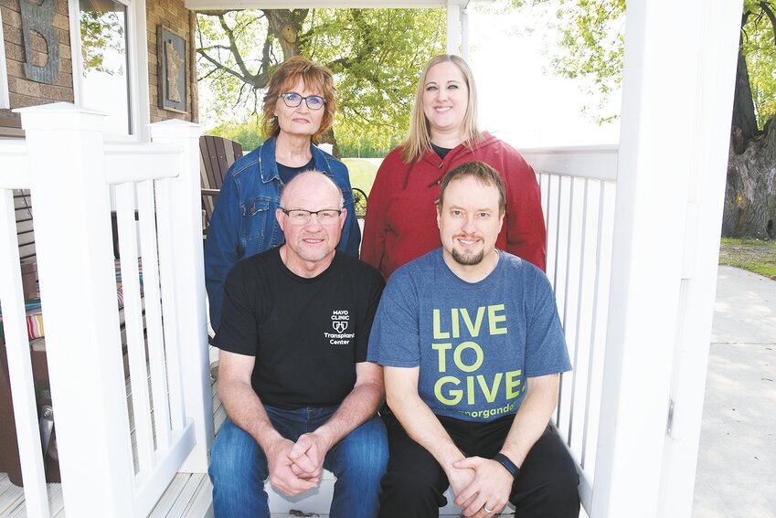 The Bromenshenkel family — Wayne (front, from left) and Derek; (back, from left)  and their wives, Pat and Heidi — gathers May 10 at the Bromenshenkel farm near Sauk Centre, Minnesota. Wayne donated a kidney to Derek, who was dignosed with polycysitic kidney disease.