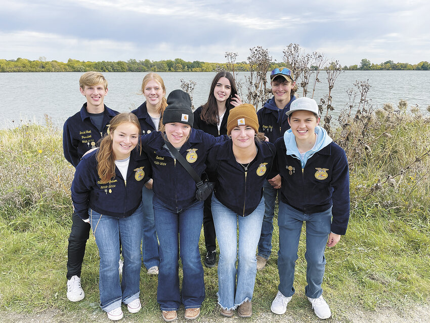 Sun Prairie East FFA members — Emily Sydow (front, from left), Lydia Statz, Marley Walters and Jackson Nesbit; (back, from left) Daniel Reid, Jorja Coutts, Sura Payne and Keegan Pagel — pose for a photo Oct. 18, 2023, at Patrick Marsh Wildlife Area following an event to teach elementary students about agriculture in Sun Prairie, Wisconsin. The Sun Prairie East FFA Chapter has 377 members and does a variety of volunteering and fundraising throughout the year.