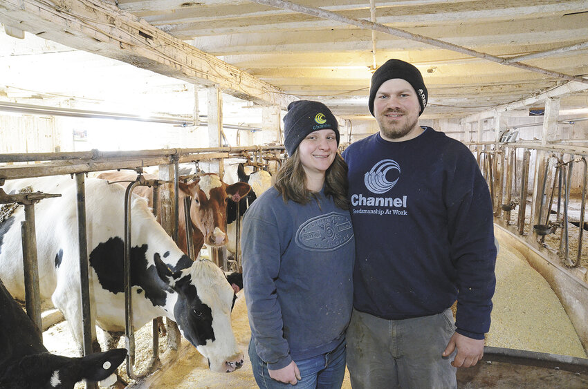 Natalie and Eli Wilterdink pose for a photo March 20 in the stanchion barn on Eli’s family’s farm, which they began renting Jan. 1, near Sheboygan Falls, Wisconsin. Along with Eli’s sister, Aimee Moehring, and their dad, David Wilterdink, the couple milks 85 cows and farms 250 acres.