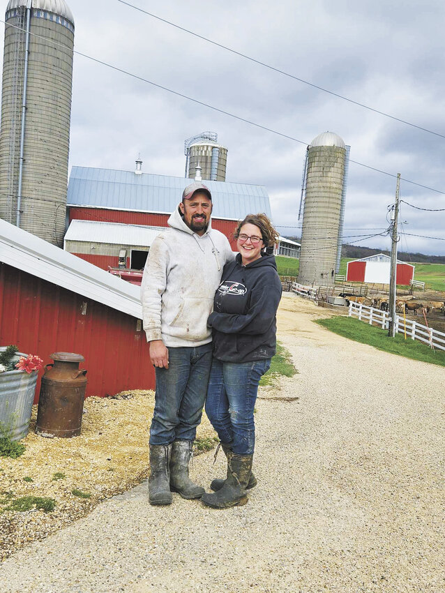 Dylan and Bryanna Handel take a break April 17 at their farm near Barneveld, Wisconsin. The Handels milk 60 cows and have been struggling with stray voltage since December 2023.