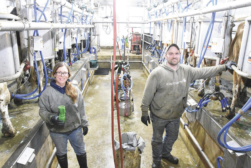 Becky Heinz and Tom Kampsen milk cows April 13 in the double-7 herringbone parlor they built last fall near New London, Minnesota. The couple is milking 100 cows.