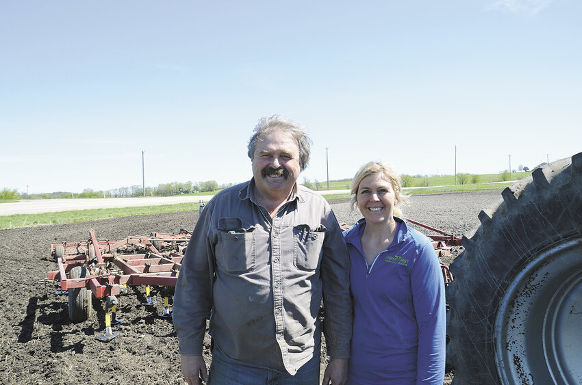 James McManama and his daughter, Rachel Schroeder, take a break from cultivating May 1 on their farm where they milk 90 cows and farm 500 acres near Watertown, Wisconsin. These dairy farmers took to the fields for the first time this year on May Day to start planting corn.