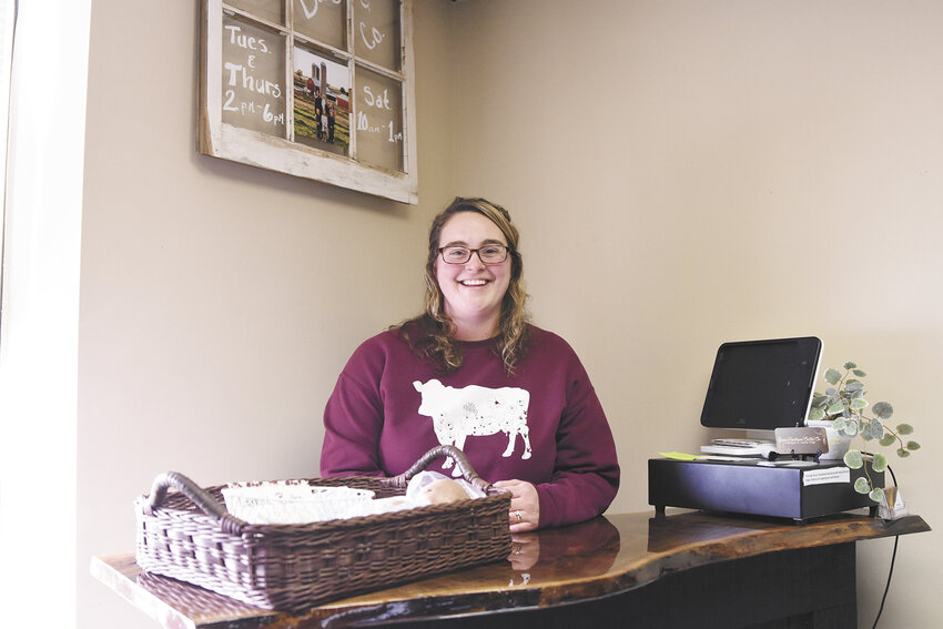 Bryanna Handel stands behind the counter at the B.Kurt Dairy & Co. storefront Feb. 18 in Barneveld, Wisconsin. She and her husband, Dylan, opened the store in January to provide a farm-to-table experience for consumers.
