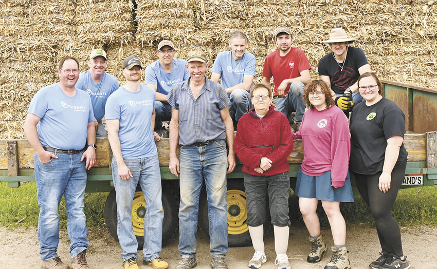 The rock picking crew — Kevin Uphoff (front, from left), Evan Welle, David Job, Alice Job, Emma Anderson and Sarah Middendorf; (back, from left) Andy Welle, Corey Sand, Dale Job, Jon Job and Ben Sonnek — takes a break May 28 at the Job family farm near Freeport, Minnesota. The team worked for four hours to pick rocks for the Job family who won the 2025 Dairy Star and Magnifi Financial annual rock picking contest. Not pictured are Tiffany Klaphake and Todd Bussmann.