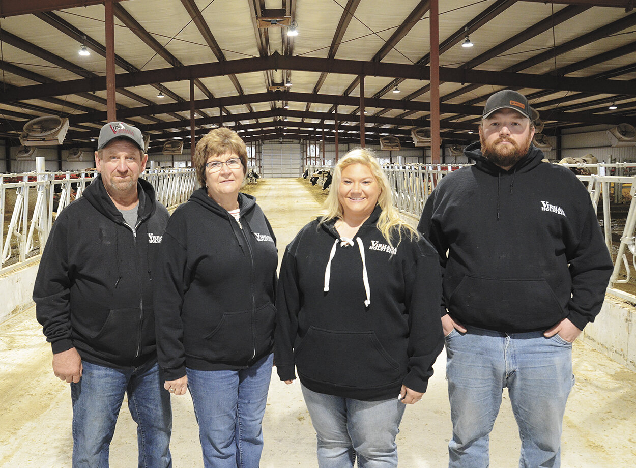 The Haag family — Virgil (from left), Dawn, Karsen and Kody — gather in their new robot barn Oct. 12 on their farm near Mount Horeb, Wisconsin. The Haags milk 200 cows with four Lely A5 robotic milking units.