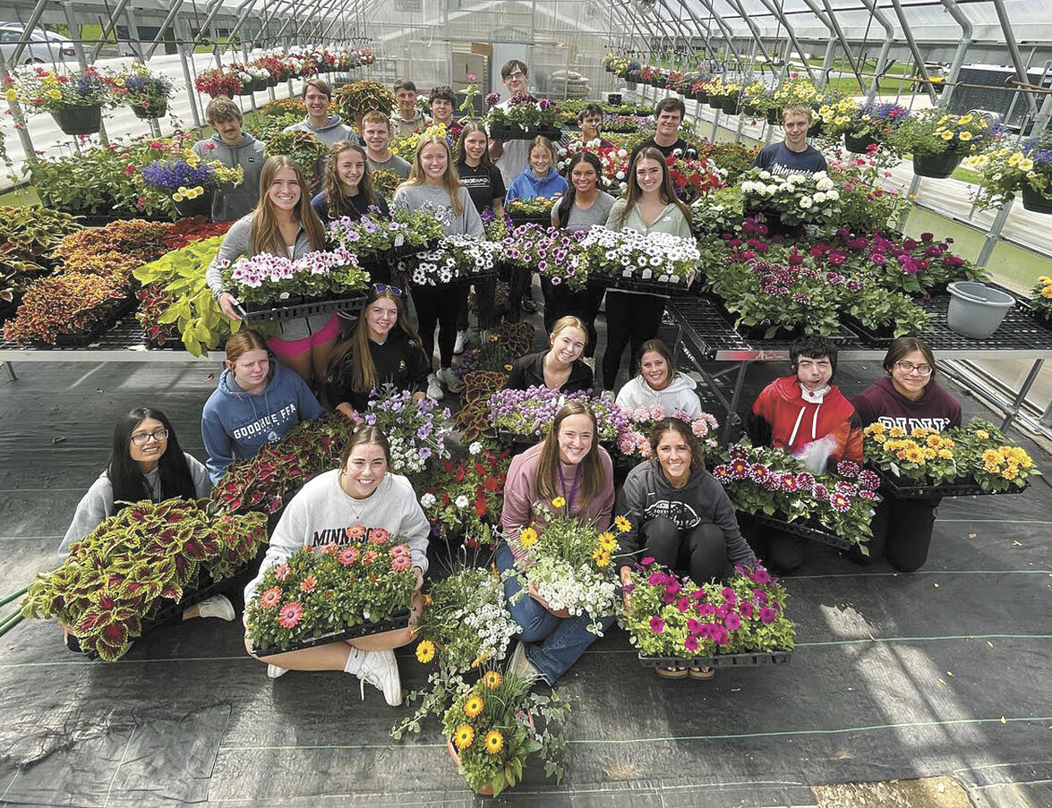 Plant science class members gather with the plants they grew for the Goodhue FFA Chapter’s plant sale in the Goodhue Public School’s greenhouse in Goodhue, Minnesota. The chapter receives their plants at the beginning of February and sells them during Mother’s Day weekend.