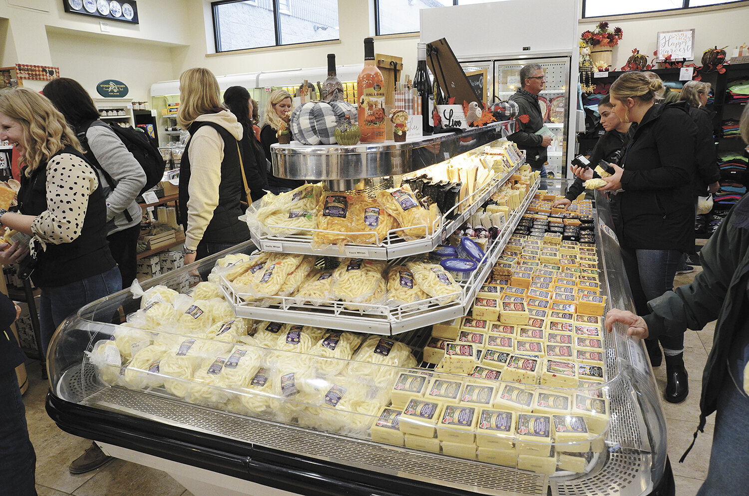 Attendees of the Professional Dairy Producers Dairy Processor Tours shop at Henning’s Cheese Oct. 26 near Kiel, Wisconsin. The store offers fresh, warm curds and a wide variety of cheese and cheese spreads as well as wine, sausage, and Wisconsin souvenirs and charcuterie items.