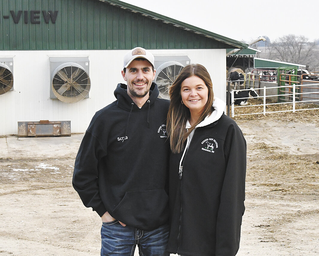 Marshall and Alyssa Friese stand outside the barn Jan. 5 at Rodash-View near Wanamingo, Minnesota. Marshall recovered after being crushed between a skid loader and the unloader of the mixer June 12, 2023, and is back working on the dairy farm.