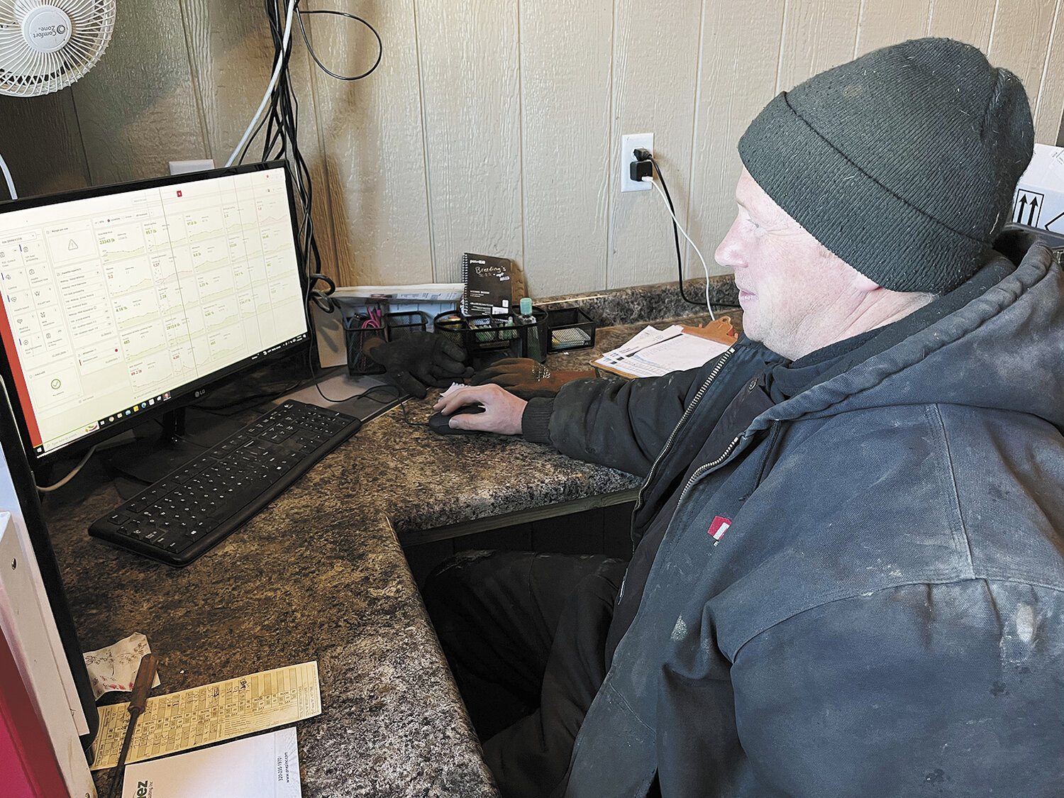 John Vander Waal uses the information gathered by his milking robots to monitor his dairy herd’s health and milk production Jan. 16 on his farm near Sioux Center, Iowa. Vander Waal has used selective genetics to increase milking speed and milk components.