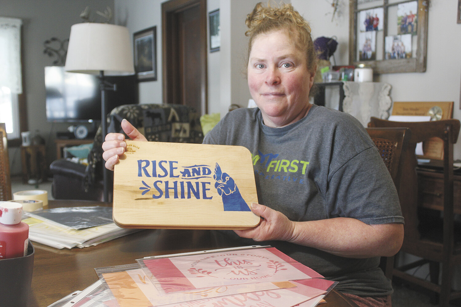 Melissa Boehlke displays an example of a stencil art craft Jan. 22, like the ones that will be featured at the Dairy Moms social she is hosting, in Thorp, Wisconsin. Boehlke is hosting the Feb. 15 event as a way to help central Wisconsin dairy women connect with other like-minded people.