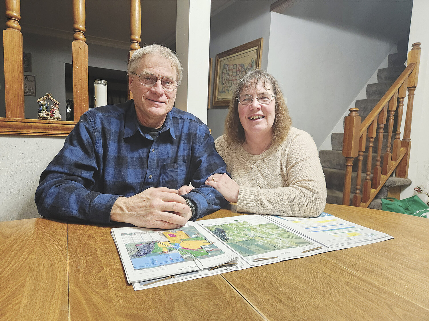 Harvey and Jackie Menn look over their conservation plans Jan. 23 at their farm near Norwalk, Wisconsin. The Menns received the Monroe County Conservation Farmer of the Year award Jan. 27.