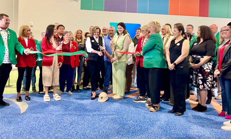 (Photo by Michelle Kuester)
Rhonda Robson and Abigail Schultz (center), CEO and Early Learning and Youth Development Coordinator, respectively, for the Norm Waitt Sr. YMCA, cut the ribbon with other staff and the members of the Siouxland Chamber of Commerce and South Sioux City Area Chamber of Commerce.
