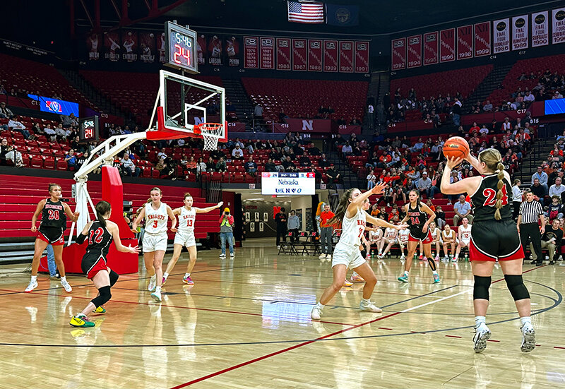 Rylie Harris (24) fires up a 3-pointer during the first half of Thursday's Class C-2 first-round matchup with Oakland-Craig at the Devaney Center in Lincoln.