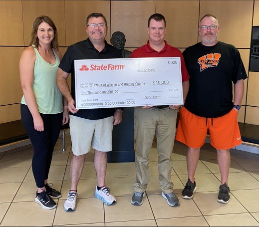 The YMCA received a $10,000 donation from State Farm. Pictured left to right: Stacie Stone, David Richey, Joey Cathey, and Bart Goodwin.