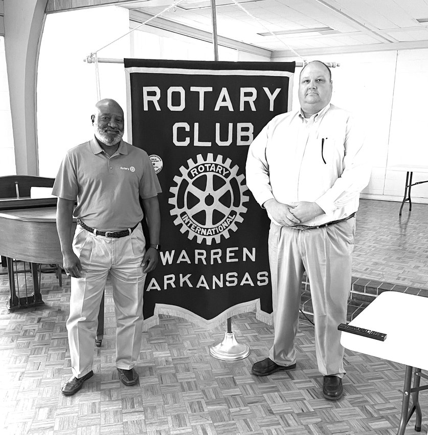 Rotarians Andrew Tolbert (left) brought fellow rotarian Warren Superintendent Bryan Cornish (right) as the guest speaker.