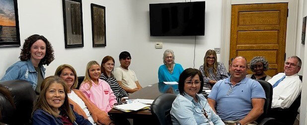 Shown, from left to right, (standing) Payton Reep, East Lab instructor; (seated)Jennifer Rodriguez, Former Mayor Denisa Pennington, East Lab students Jolie Trussell, Anna Grace Mitchell, and Aaron Barajas; (back of table) Cathy Richardson and East Lab student Ashlyn Crawford; Gwen Bullard, Ken King, Glenn Lockeby, and Dana Harvey. (Not pictured) Jimmy Sledge and East Lab student Sarah Forrest.