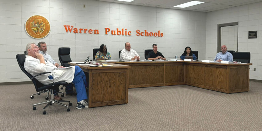 The Warren School Board listens as Karen Burnette makes a presentation about a grant for students to receive needed help for possible mental health issues.