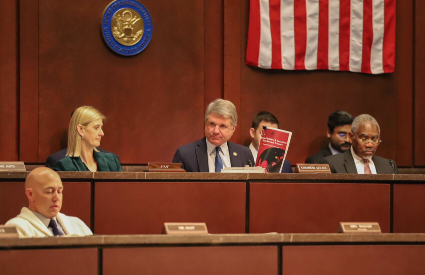 Chairman McCaul conferring with Rep. Brian Mast (R-FL)