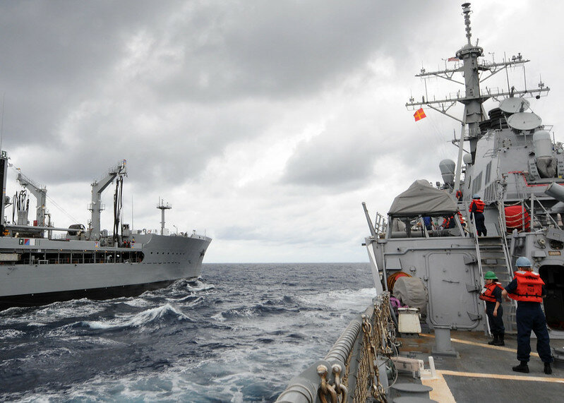 The guided-missile destroyer USS Laboon (DDG 58) conducts a replenishment at sea with the Military Sealift Command fleet replenishment oiler USNS Big Horn (T-AO 198).