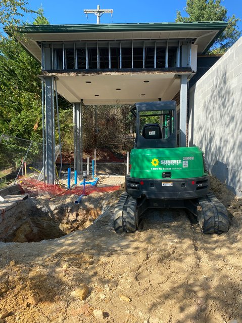 Excavator in front of the entrance of the new ER building