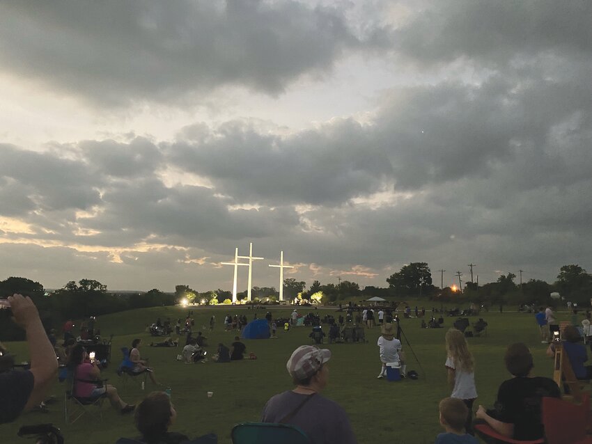 Those in attendance at the Eclipse at the Crosses event look up to the heavens to view the total solar eclipse. About 600 were in attendance on the church grounds.