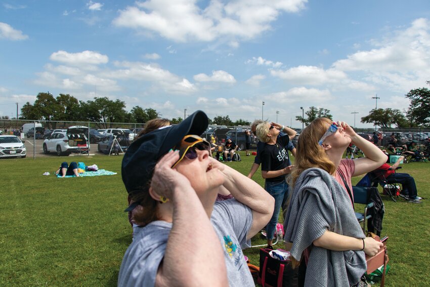 Visitors watch the total solar eclipse from the Gatesville Sports Complex on Monday.