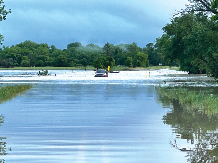 A car submerged in flood water on FM 1829 between FM 107 and State Highway 36.
