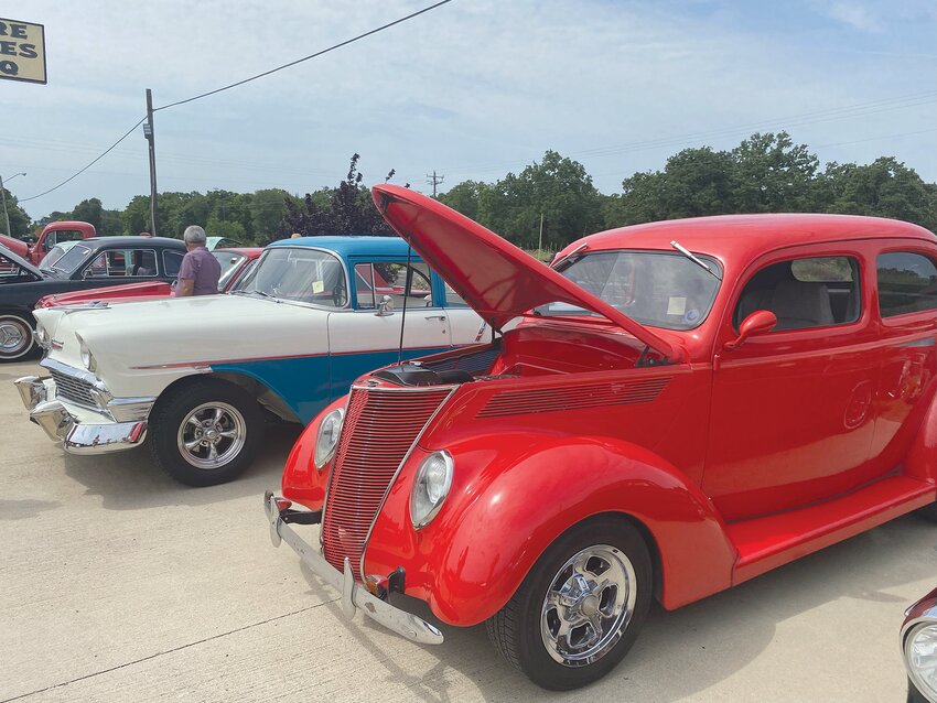 Classic cars line the parking lot of Bare Bones BBQ at a recent car show held to benefit the Disabled American Veterans program.