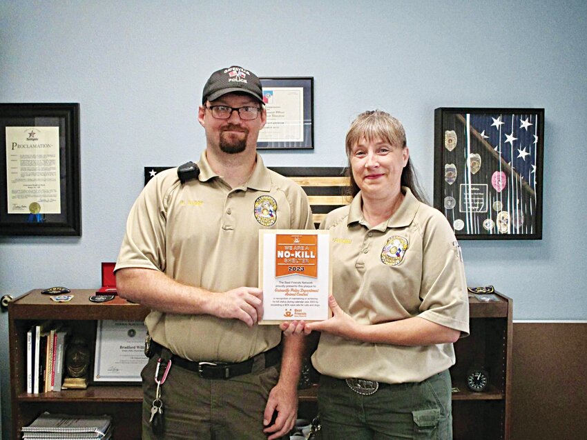 Animal Control Officers Douglas Glimp (left) and Crystal Cockrell are pictured after receiving their recognition with ‘The Best Friends Network’ for being a No-Kill Shelter.