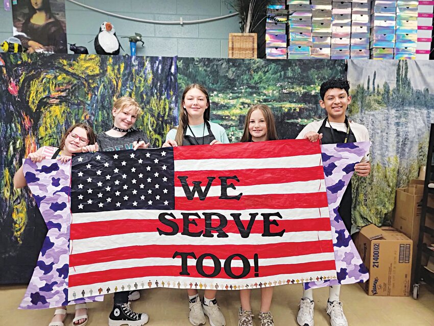 Gatesville Junior High School art students are pictured holding up the banner they created for Month of the Military Child. Pictured (left to right) are Addison Van De Water, Courtney Baker, Hally Dubay, Landri Stevens, and Axel Servin Cardenas.
