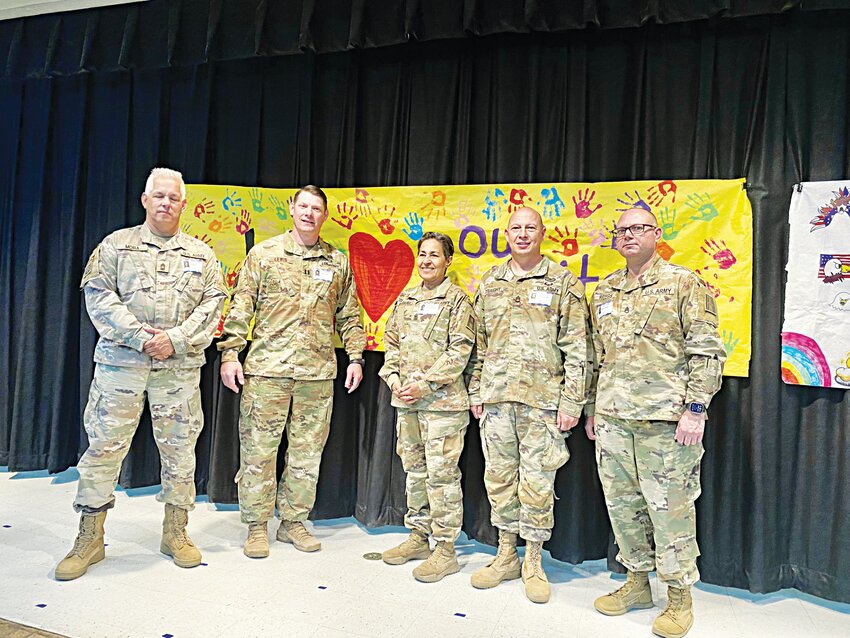 Members of the 120th Infantry Brigade who have adopted Gatesville Intermediate School.