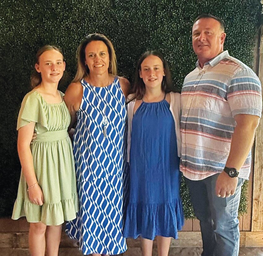 Gatesville ISD’s new junior high girls’ basketball coach, Michelle Weaver Richardson, pictured with family