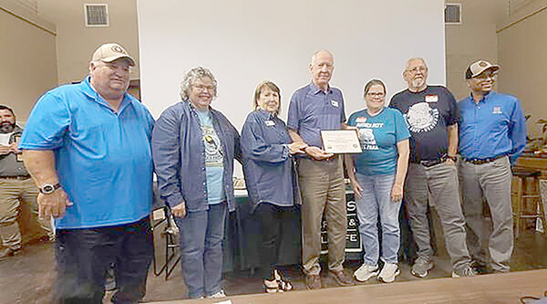 Members of the Mother Neff State Park Association receive an award from the Texas State Parks. Pictured left to right is Bobby and Lois Anderson, Charlotte and Larry Weiss, Becky Roe, Miles Ellis, and TPWD’s Director of State Parks Rodney Franklin.
