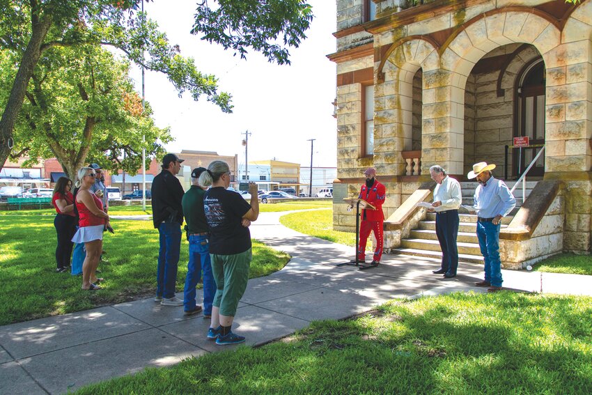 A crowd gathers in front of the Coryell County Courthouse to hear Paul Harrell, Allen Place, and Judge Grant Kinsey read the Declaration of Independence.
